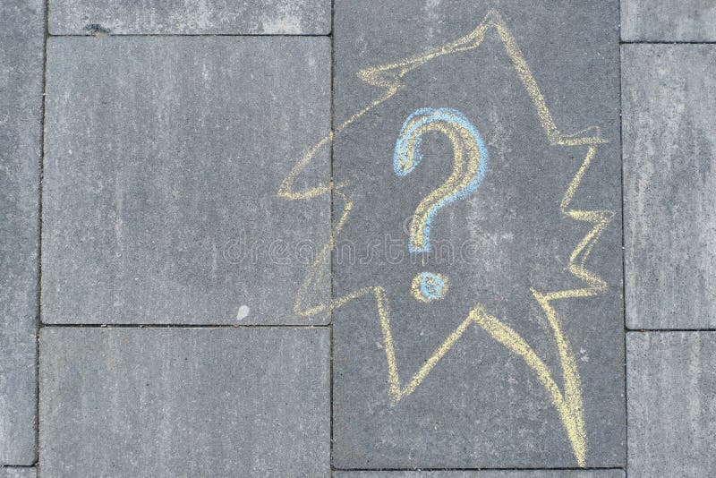 Abstract question mark drawn in crayons on gray asphalt stock photography