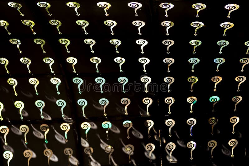 Abstract question mark wall on dark background royalty free stock photo