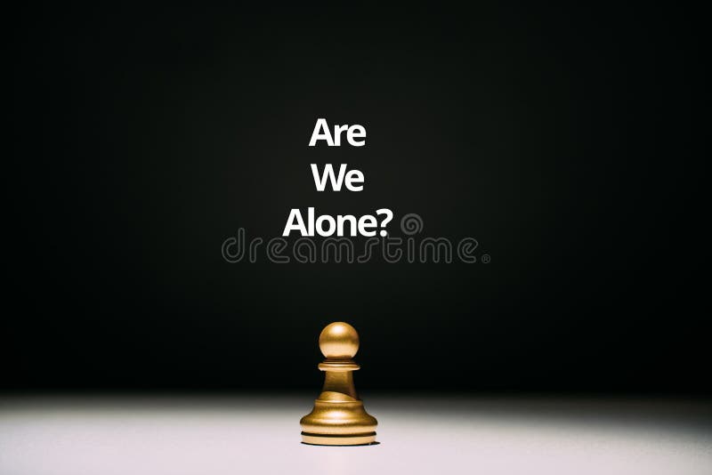 An abstract question in psychology. Are we alone. One pawn on the table. stock photos