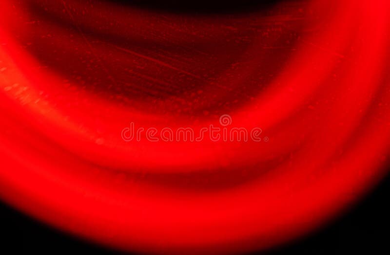 Abstract red light motion blur with curved lines on dark background, glowing wave texture with vibrant energy effect stock photo
