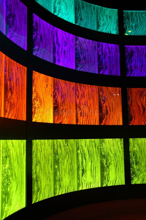 Retro colored lightings brighten up liquid filled tanks forming a colorful background. Retro colored lightings brighten up liquid filled tanks forming a colorful background