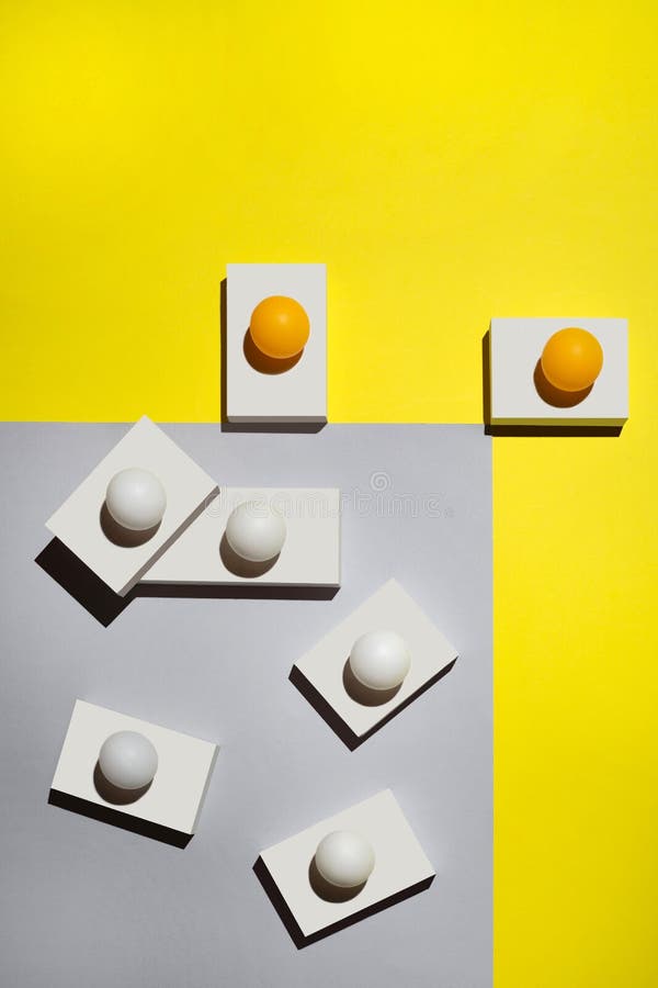 Abstract Still life with white figures and balls on a colored background royalty free stock photography