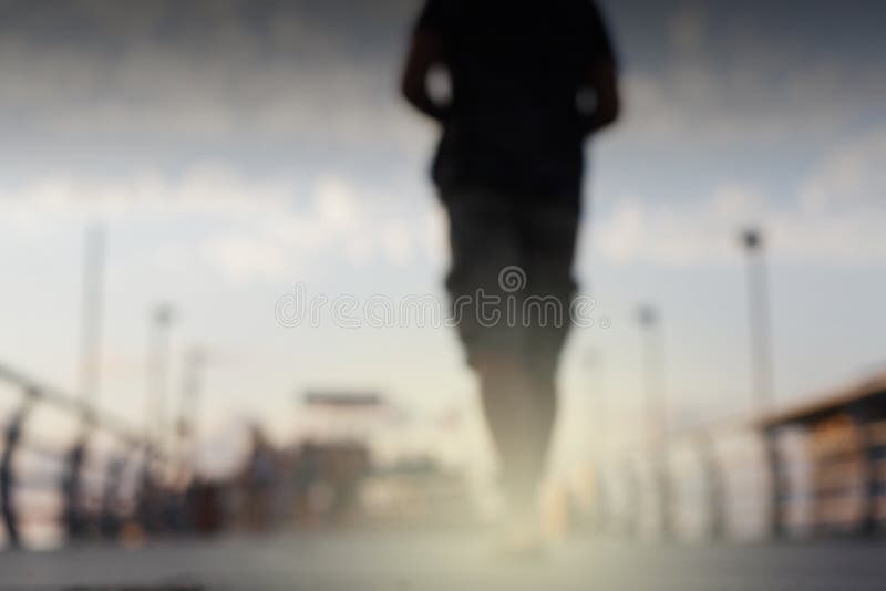 Abstract street city light blur blinking background. Soft focus. Man silhouette