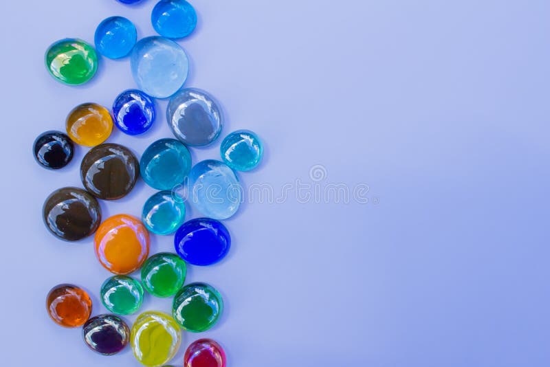 Abstract texture background of bright colorful glass beads on plain background