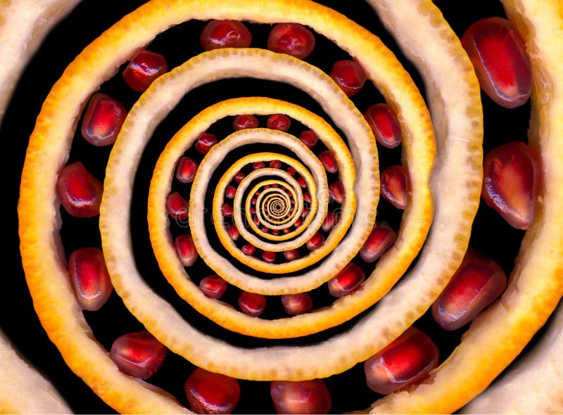 Abstract texture fractal spiral made of fruits: orange and lemon citron, pomegranate seeds. Fruit spin. Abstract food fruit fracta royalty free stock images Abstract texture fractal spiral made of fruits: orange and lemon citron, pomegranate seeds. Fruit spin. Abstract food fruit fracta royalty free stock images