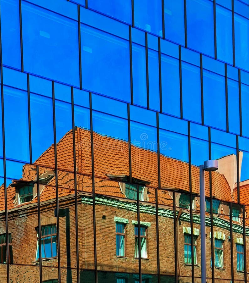 Windows reflection modern new building and old vintage house blue  glass and stone of front house wall  red heart