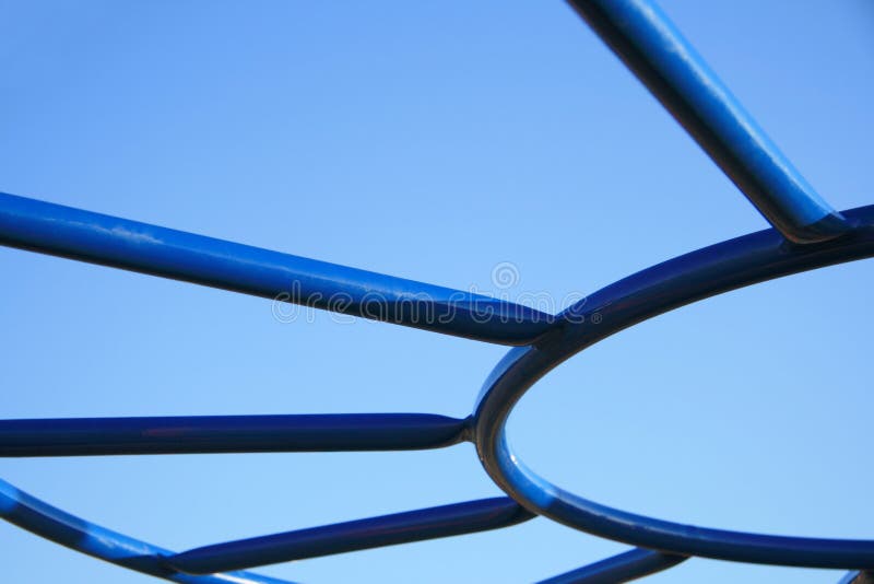 Abstract detail of playground equipment against a clear blue sky. Abstract detail of playground equipment against a clear blue sky