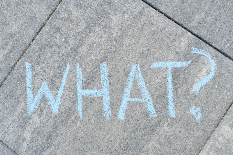 Abstract what question mark drawn in crayons on gray asphalt stock images