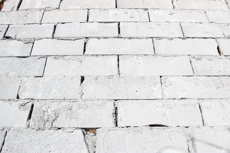 Abstract White Brick Wall Texture Depicting in Paint Colors on an Old