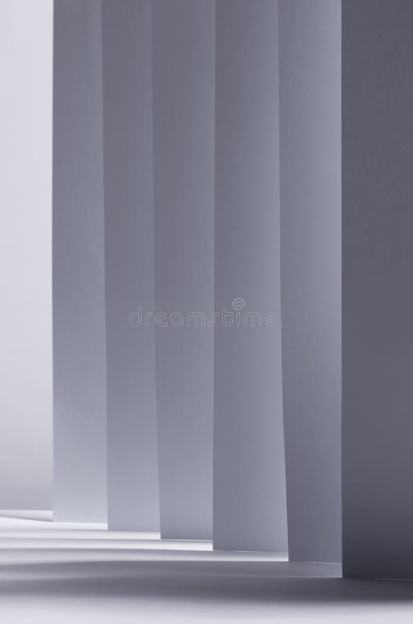 Abstract white grey background with contrast perspective of stripes, light and shadow as pattern, vertical. royalty free stock photo