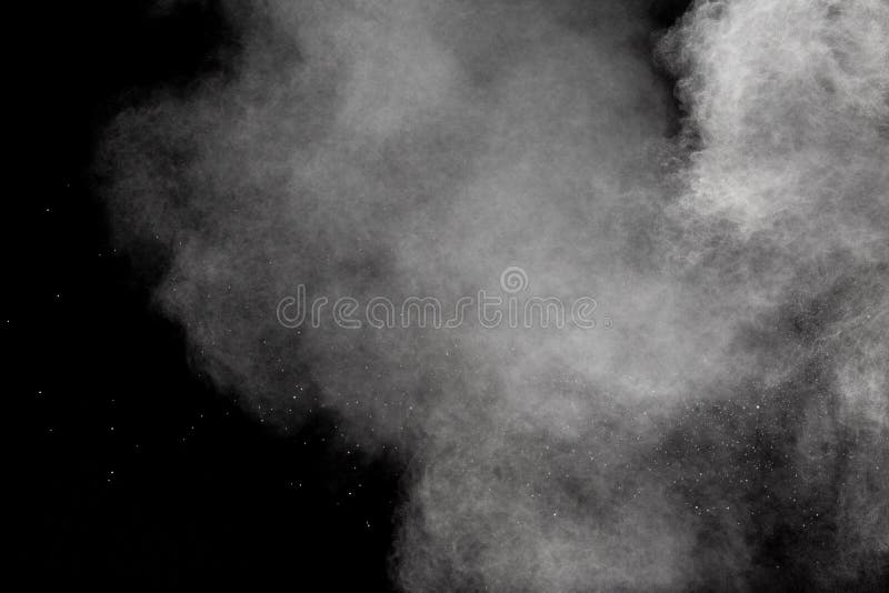 Abstract white powder explosion against black background. White dust cloud in the air royalty free stock images