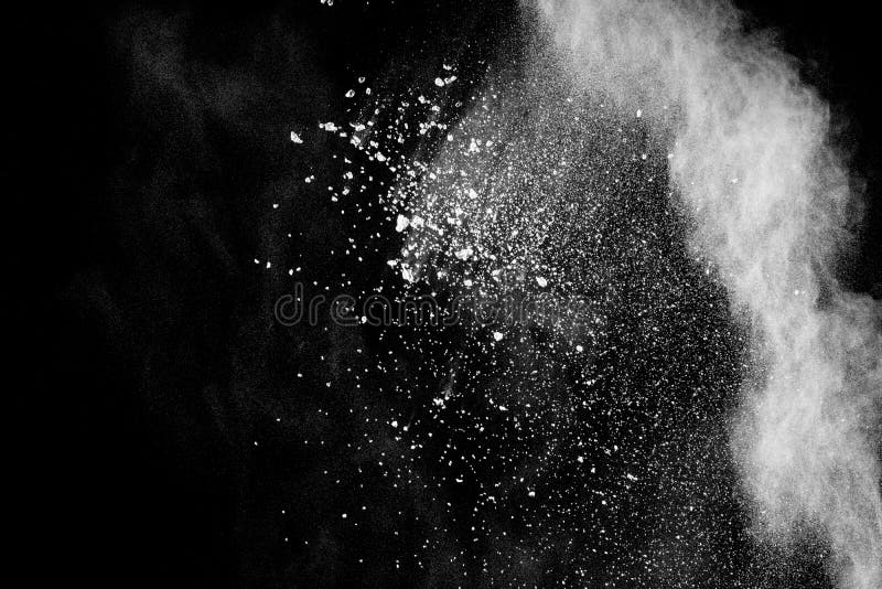 Abstract white powder explosion. White dust debris on black background stock photography