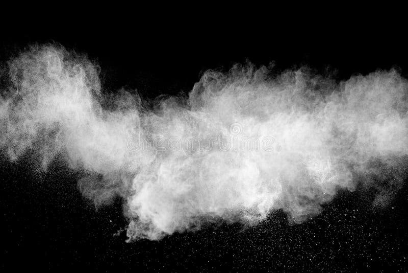 Abstract white powder splatter on black background,Freeze motion of white powder exploding royalty free stock photography