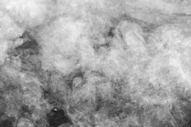 Abstract white smoke on black background. White smoke cloud stock images
