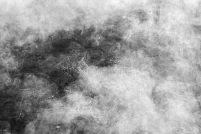 Abstract white smoke on black background. White smoke cloud royalty free stock photos