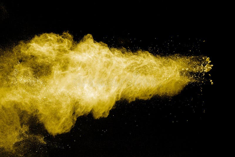 Abstract Yellow Powder Explosion on Black Background.Freeze Motion of