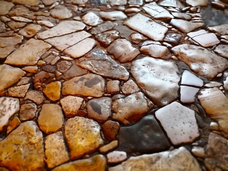 Abstracte die achtergrond met rots wordt gemaakt Close-upmening van rotsachtige straat stock fotografie Abstracte die achtergrond met rots wordt gemaakt Close-upmening van rotsachtige straat stock fotografie
