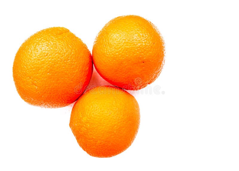 Abstraction. Background. Three yellow oranges on a white background. royalty free stock photos