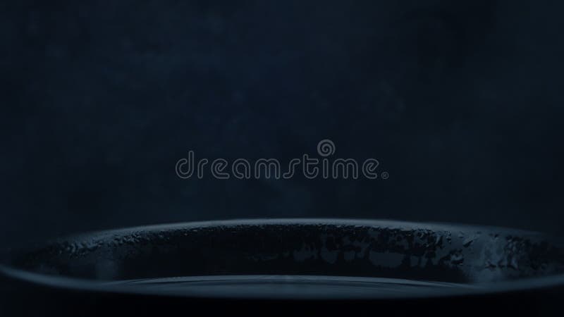 Abstraction. Blue, dark, background. Drops. motion steam from the mug is close-up