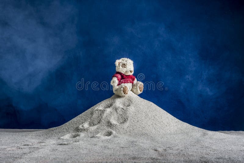 Composition of a toy and the sand
