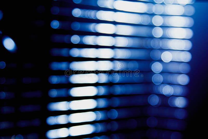 Abstract blue blur of city lighting digital lens flare glare, blinds light shadow background. Abstract blue blur of city lighting digital lens flare glare, blinds light shadow background