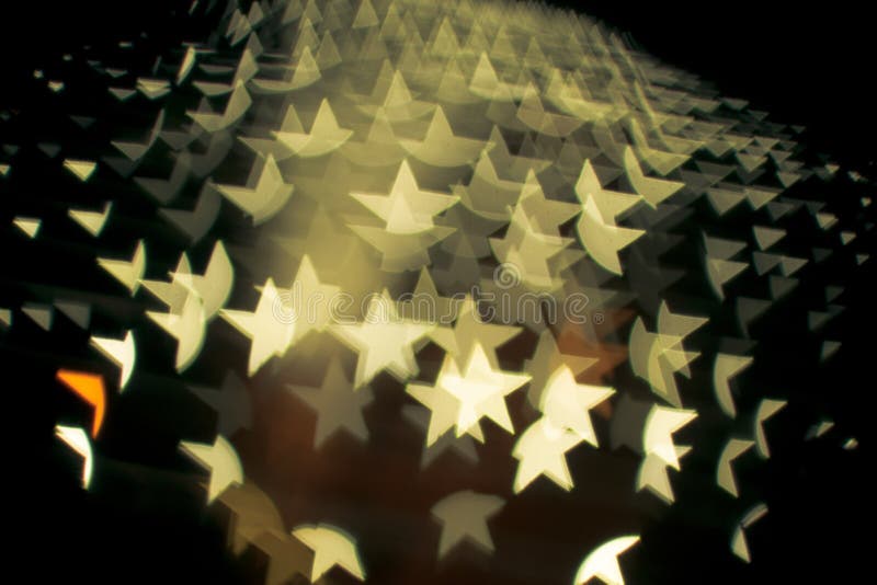 Abstract bokeh and lens flare pattern in star shape with vintage filter background. Abstract bokeh and lens flare pattern in star shape with vintage filter background