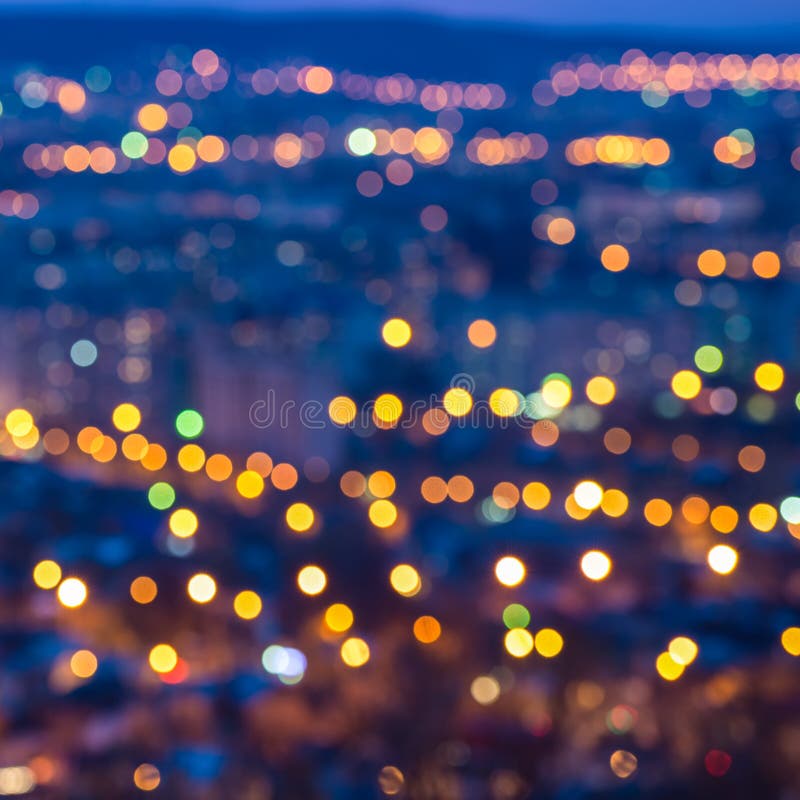 Abstrakcjonistyczny kółkowy bokeh miasto zaświeca z horyzontu kolorowym backgr fotografia stock