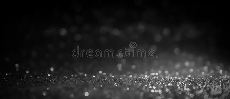 Abstrakt glitter bokeh on black bakgrund arkivfoton