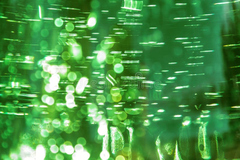 Abstrakt ljus defocused ultra skinande bakgrund för gräsplanfärg med vattentextur med bubblor med bokeheffekt royaltyfri foto Abstrakt ljus defocused ultra skinande bakgrund för gräsplanfärg med vattentextur med bubblor med bokeheffekt royaltyfri foto