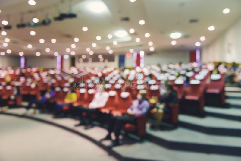 Abstract blurred of put spaces between attendee in seminar room or conference hall for social distancing to prevent the spread of Covid-19. new normal life concept. Abstract blurred of put spaces between attendee in seminar room or conference hall for social distancing to prevent the spread of Covid-19. new normal life concept