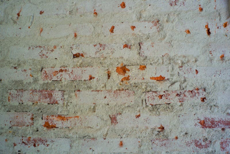 Abstrakt textur och bakgrund av murket packat cement på tegelstenväggen royaltyfri bild Abstrakt textur och bakgrund av murket packat cement på tegelstenväggen royaltyfri bild