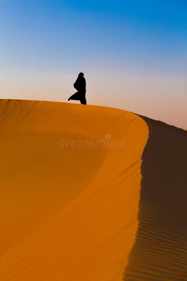Emirate woman alone in desert. Emirate woman alone in desert