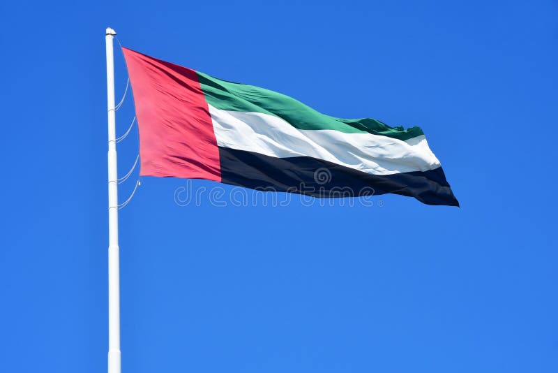 ABU DHABI, UAE - MARCH,19, 2019: National flag on blue sky background. United Arab Emirates royalty free stock photography ABU DHABI, UAE - MARCH,19, 2019: National flag on blue sky background. United Arab Emirates royalty free stock photography
