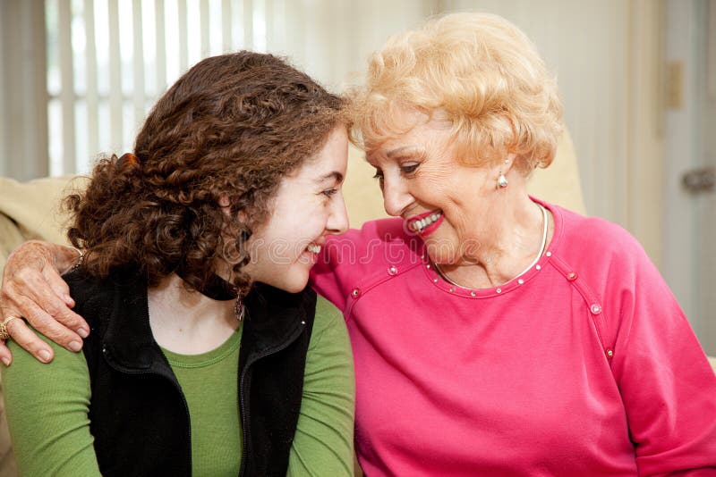 Loving teen girl and her grandmother make eye contact. Loving teen girl and her grandmother make eye contact.