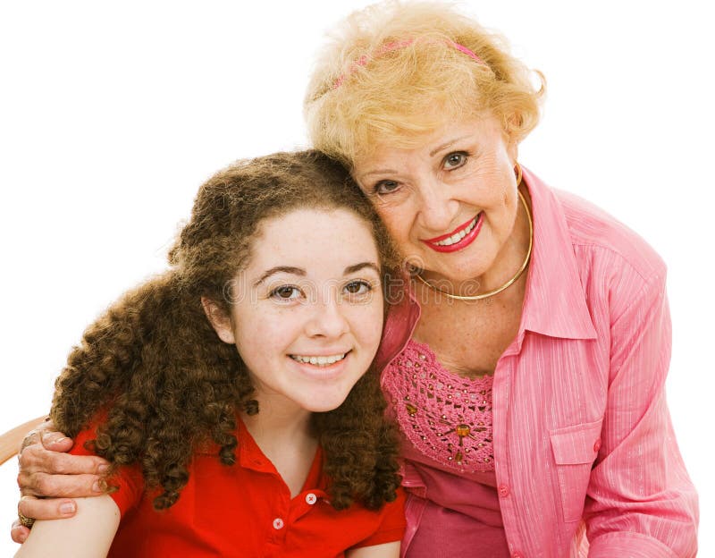 Portrait of a grandmother and her teen granddaughter over white background. Portrait of a grandmother and her teen granddaughter over white background.