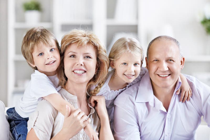 Happy mature couple with grandchildren. Happy mature couple with grandchildren