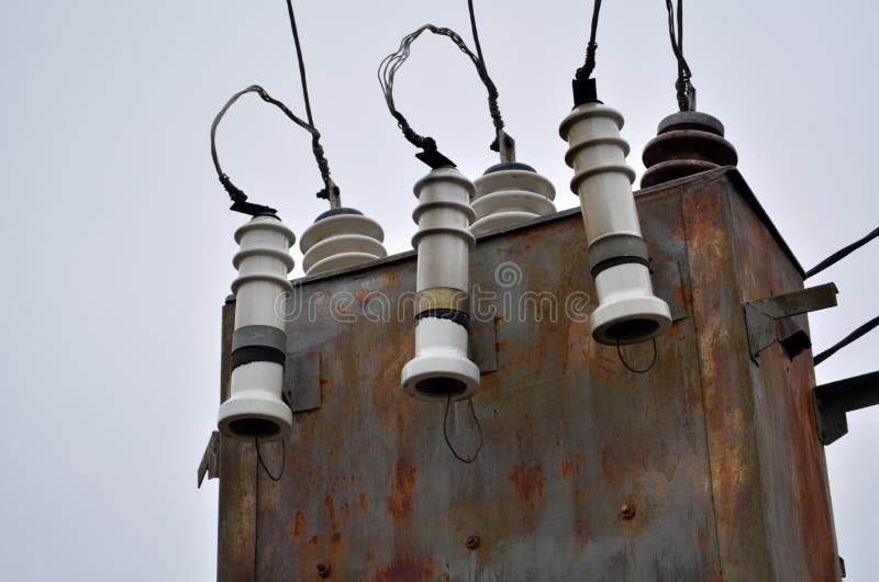 AC high-voltage power transformer. Electrical energy transfer to end users through distribution transformer on concrete pole stock photography AC high-voltage power transformer. Electrical energy transfer to end users through distribution transformer on concrete pole stock photography