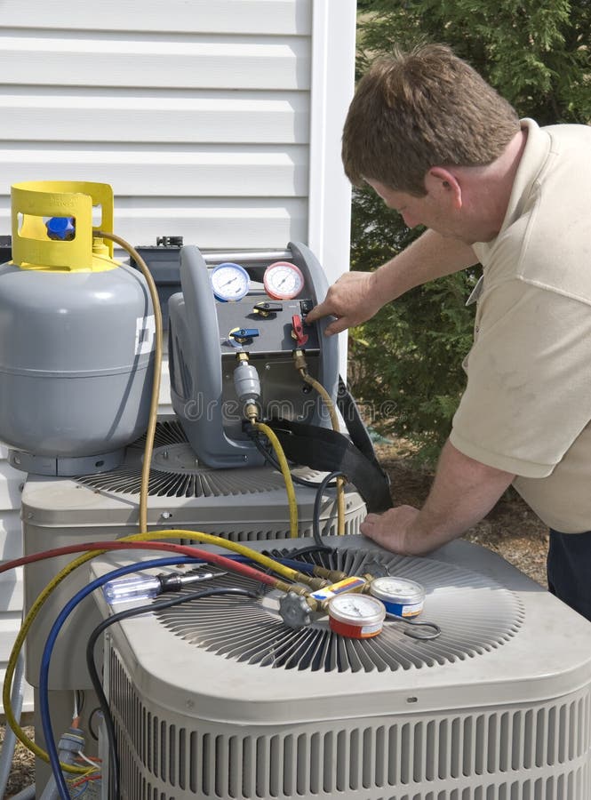 Repairman Working on Air Conditioner Stock Photo Image of tool