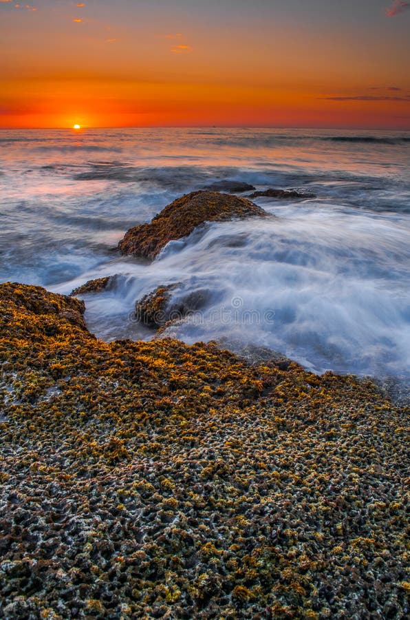 The sun sets at Sunset Cliffs in San Diego, CA. The sun sets at Sunset Cliffs in San Diego, CA