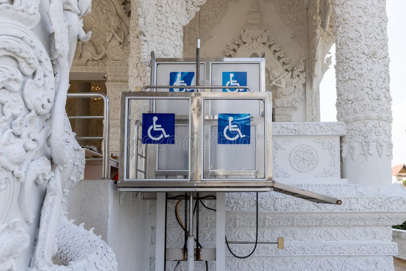 Accessible Elevator with Sign. Disabled Persons Lift Near Modern Apartment Facility Stock Image