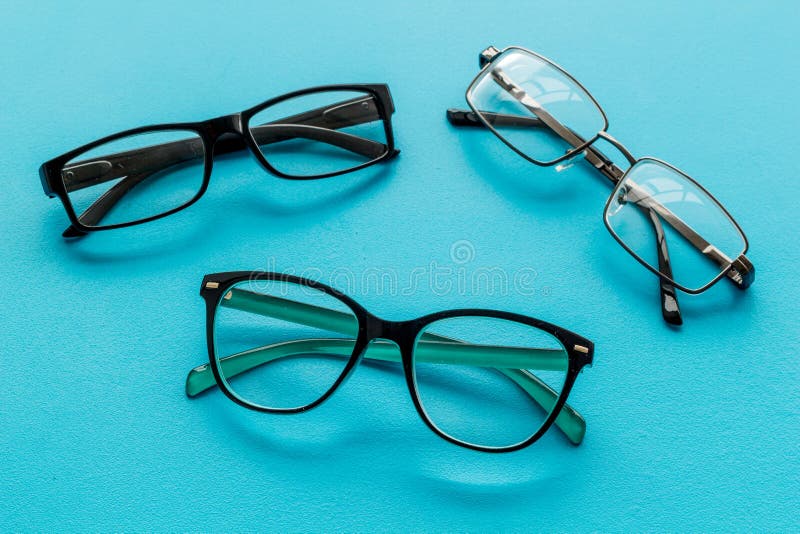 Accessories for eyes. Glasses with transparent lenses and different frames on blue background