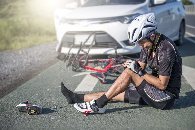 Accident Concept,Unconscious male cyclist lying on road stock photos Accident Concept,Unconscious male cyclist lying on road stock photos