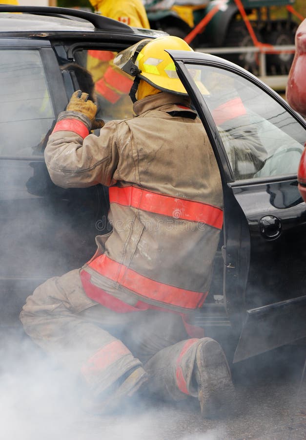 Fireman at the scene of a car accident. Fireman at the scene of a car accident.