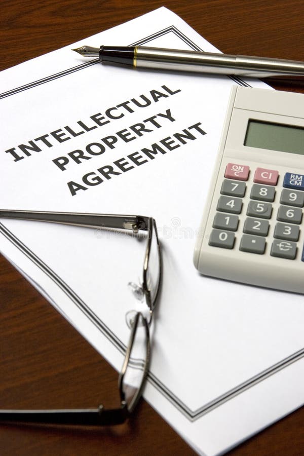 Image of an intellectual property agreement on an office table. Image of an intellectual property agreement on an office table.