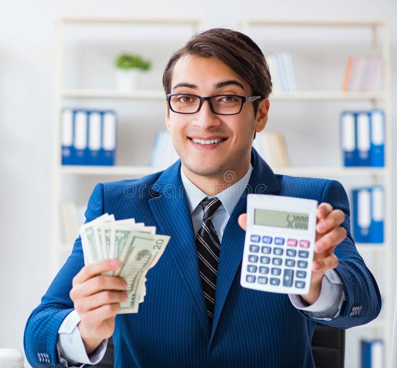 Accountant Calculating Dollars with Calculator in Office Stock Image