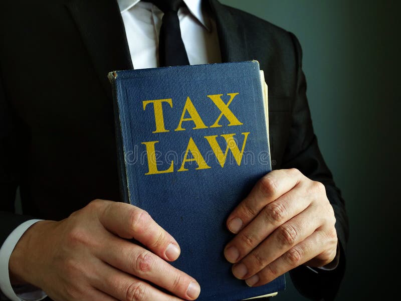 Accountant Holds Tax Law Book Stock Image Image of book,