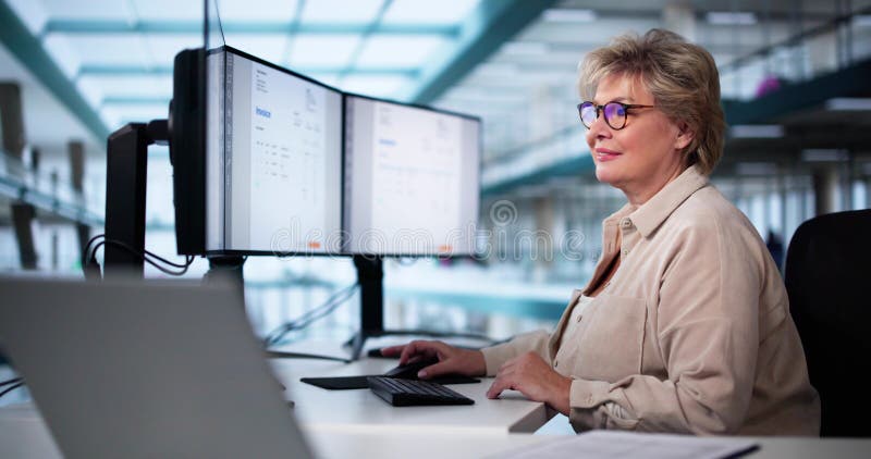 Accountant Using E Invoice Software At Computer royalty free stock image