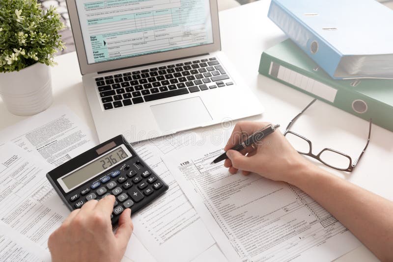 Accountant working with US tax forms royalty free stock images