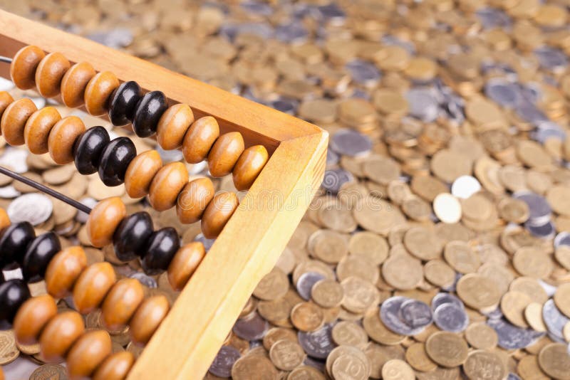 Accounting abacus and coins