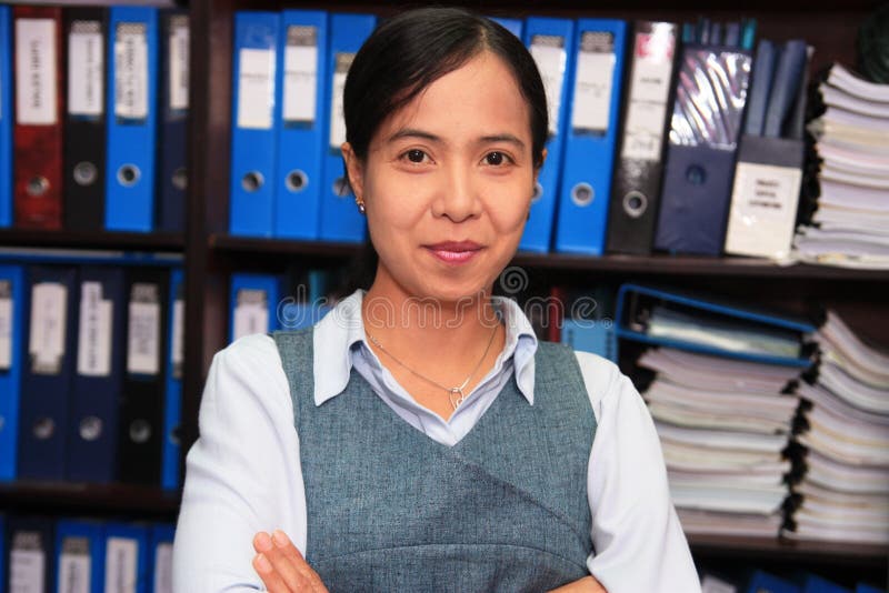 Portrait of accounting staff at work. Standing file folder stock images, royalty-free photos and pictures
